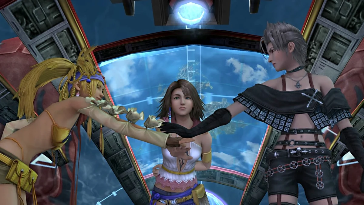 Tidus y Yuna caminando por una playa de Spira en Final Fantasy X