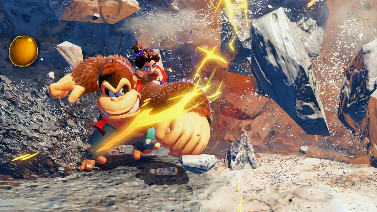 Donkey Kong golpeando el suelo en un cañón, con Pauline saltando detrás y escombros en el aire