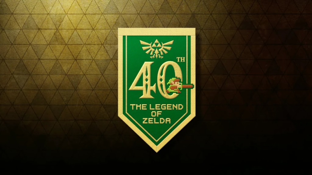 Estandarte dorado del 40 aniversario de The Legend of Zelda con el emblema de la Trifuerza y Link en píxeles
